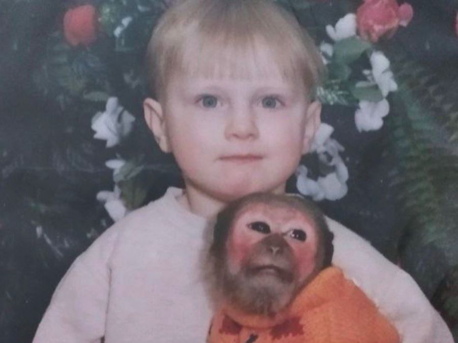 Stanislav as a boy in Belarus, a monkey in his arms
